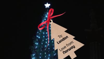 Christmas Tree in Trafalgar Square with a present tag which reads ' To London, Love From Norway'