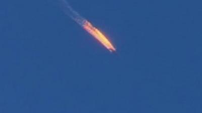 Russian plane engulfed in flames after being shot by Turkey