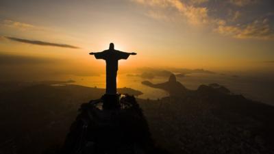 Christ the Redentor statue over Rio at sunset