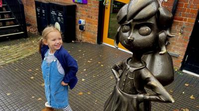 Carrie with a statue of Matilda