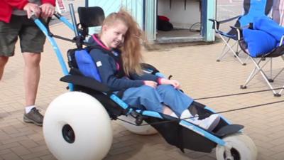 girl in beach wheelchair