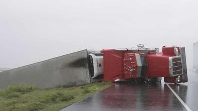 Lorry on side in road