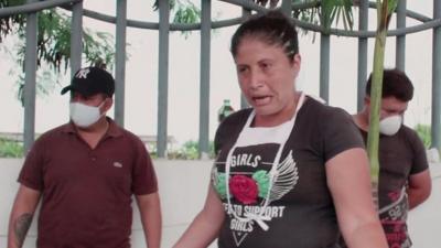 Woman in Ecuador waiting for her relative's body