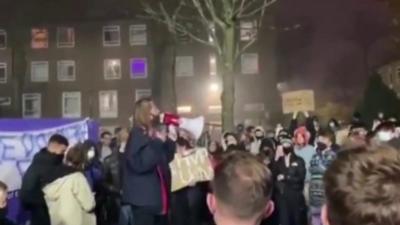 A female student speaks during a protest on Fallowfield campus.