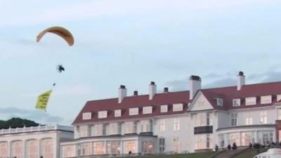 Glider protester at Trump's resort