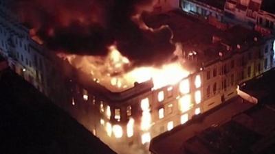 A building in Lima, Peru on fire during anti-government protests