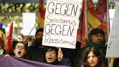 Demonstrators marching through the main railway station of Cologne