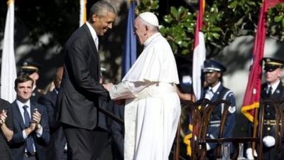 President Barack Obama and Pope Francis shake hands