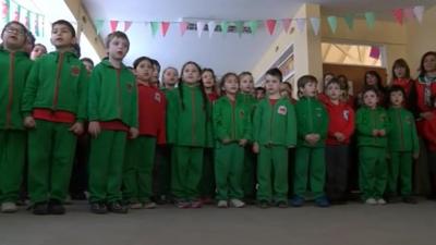 Children sing for Carwyn Jones at Ysgol Yr Hendre in Trelew, Patagonia