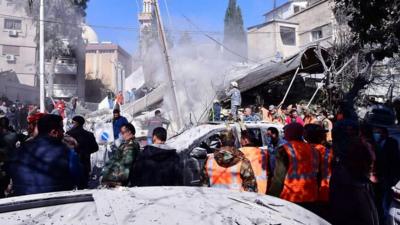 Rescuers and soldiers at site of air strike