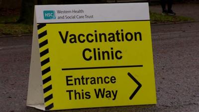 A sign that reads: Vaccination clinic entrance this way