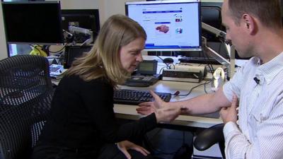 Michelle Roberts looking at Moles on an arm