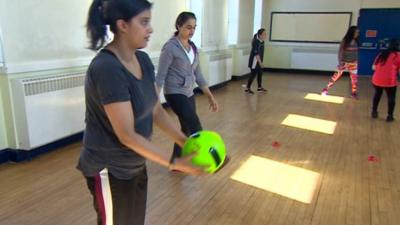 Mothers playing football