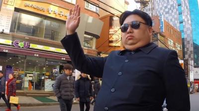 Dragon Kim impersonates Kim Jong-il.