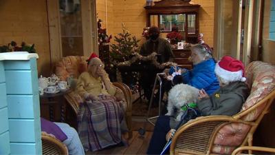 Care home residents sitting on a sofa