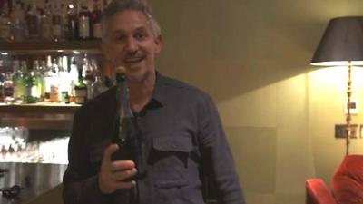 Lineker celebrates with champagne