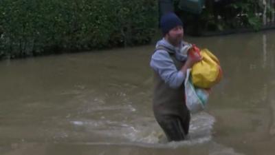 Man wading through water in York