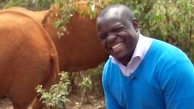 Ferdinand Omondi and a baby elephant