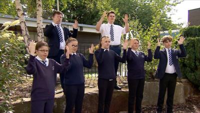 Pupils at the Royal School for the Deaf Derby signing the national anthem