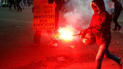 Protesters clash with anti-riot police