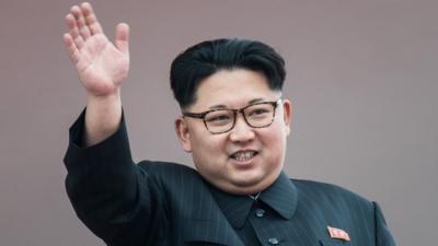 North Korean leader Kim Jong-Un waves from a balcony following a mass parade marking the end of the Party Congress on 10 May, 2016.