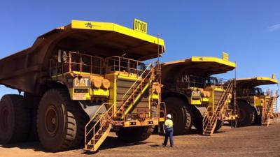 Giant trucks at the the Cloudbreak mine