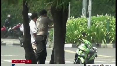 Police behind tree