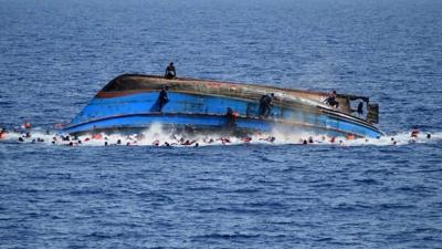 A trawler carrying hundreds of migrants overturned in the Mediterranean - apparently as a result of people rushing to one side after spotting a rescue ship.