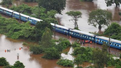 Aerial view of a stranded Indian train in a flooded area between Badlapur and Vangani following monsoon rains, 27 July