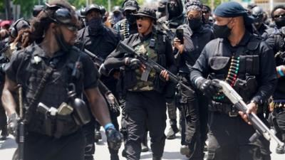 Members and supporters of an all-black militia group called NFAC