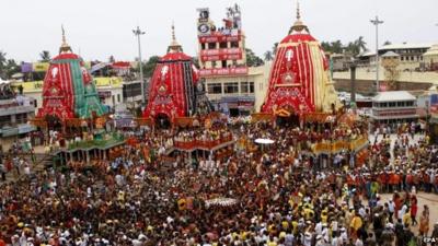 Devotees gather near the chariots in Puri, Orissa, in India