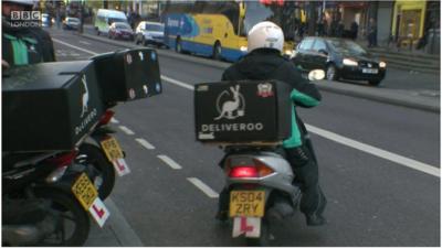 Delivery driver on moped.