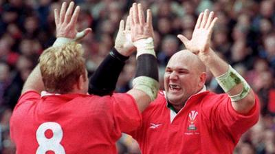 Craig Quinnell (R) and brother Scott celebrate Wales beating France in the 1999 Five Nations