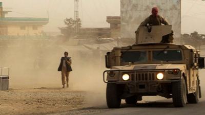 Afghan security forces in a Humvee during fighting between Taliban militants and Afghan security forces in Kunduz on Monday