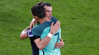 Wales' Gareth Bale and Portugal's Cristiano Ronaldo embrace