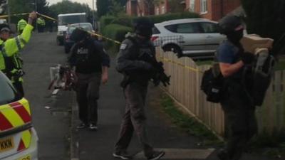 Armed police in Gorton