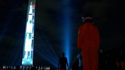 The Washington Monument lit up to look like Apollo 11