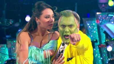 Ed Balls performing as The Mask