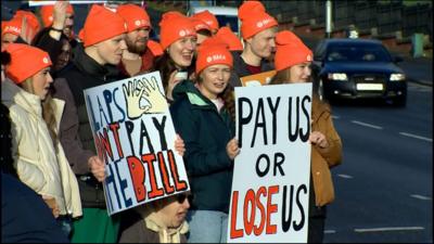 Junior doctors have taken to picket lines across Northern Ireland in a dispute over pay.