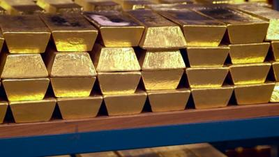 The BBC's Frank Gardner is shown how £194bn worth of gold bars are stored.