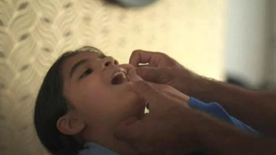 Girl showing her father her teeth