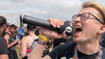 A man screaming into a mic