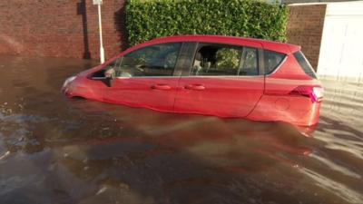 Car in the floods in Carlisle in Cumbria