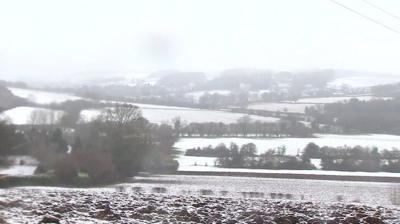 Several roads and thousands ofhomes have been affected by snowy weather conditions in the UK.