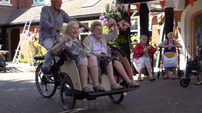 Women ride on bike