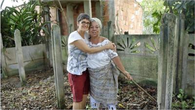 Conceicao and Lausmarina, women from different religions, hug