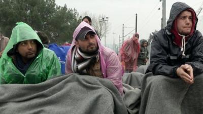 Migrants wait at the Idomeni border crossing in Greece