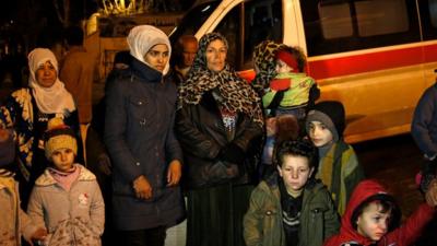 People wait to leave the besieged town of Madaya, northwest of Damascus, Syria.