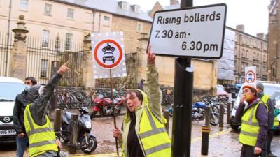 People in high visibility jackets