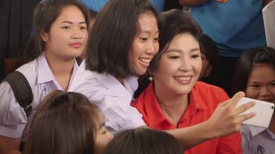 Yingluck Shinawatra and a school girl.